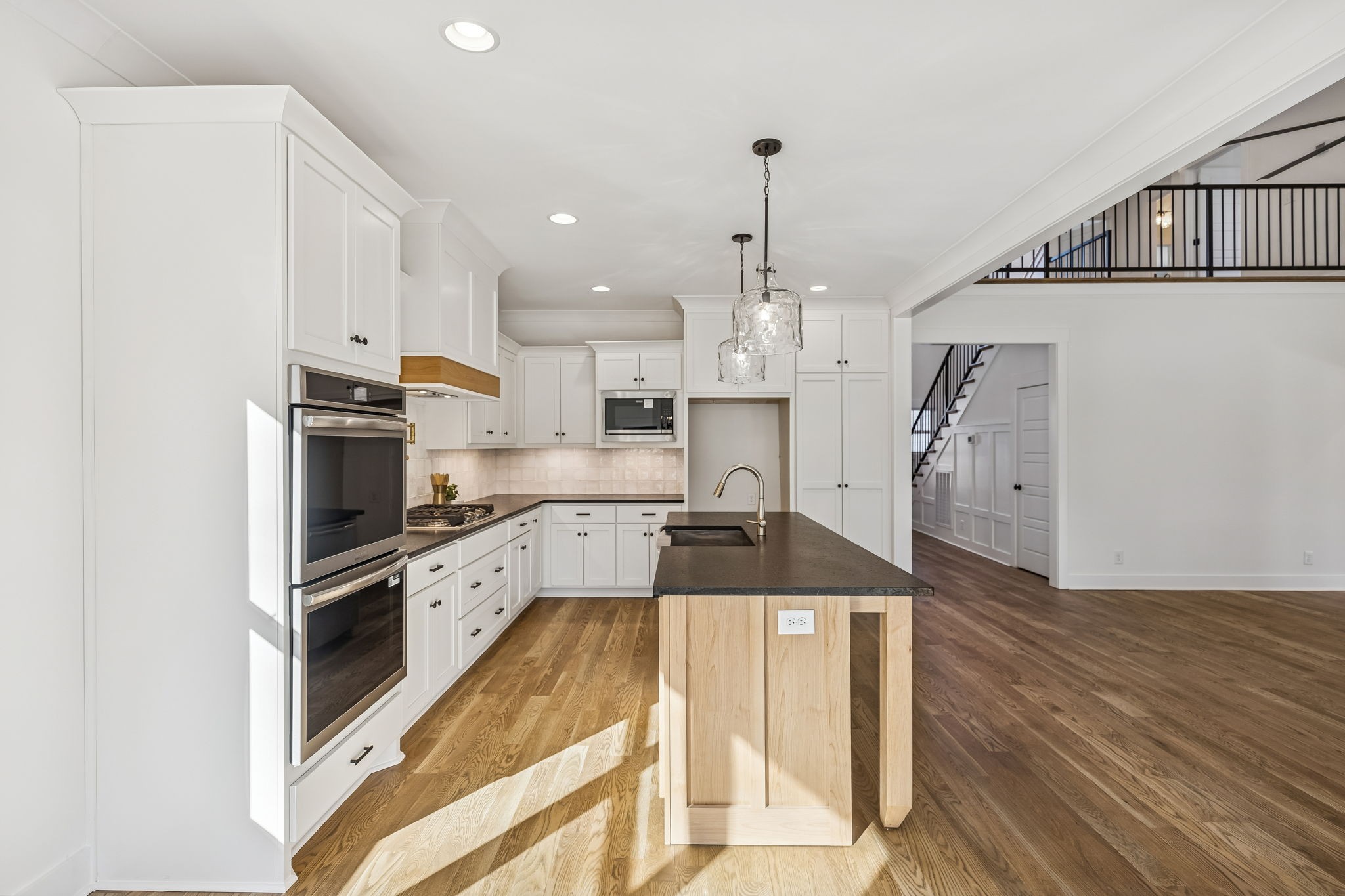 13841 Cainsville Road Lebanon, TN 37090 - Photo 22 of 81 a large kitchen with cabinets wooden floor and stainless steel appliances