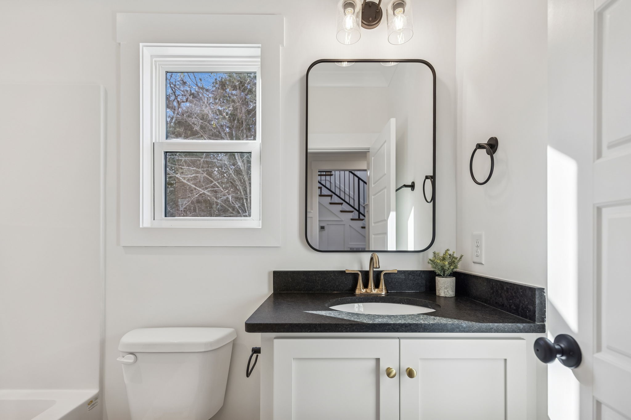 13841 Cainsville Road Lebanon, TN 37090 - Photo 28 of 81 a bathroom with a granite countertop toilet sink and mirror