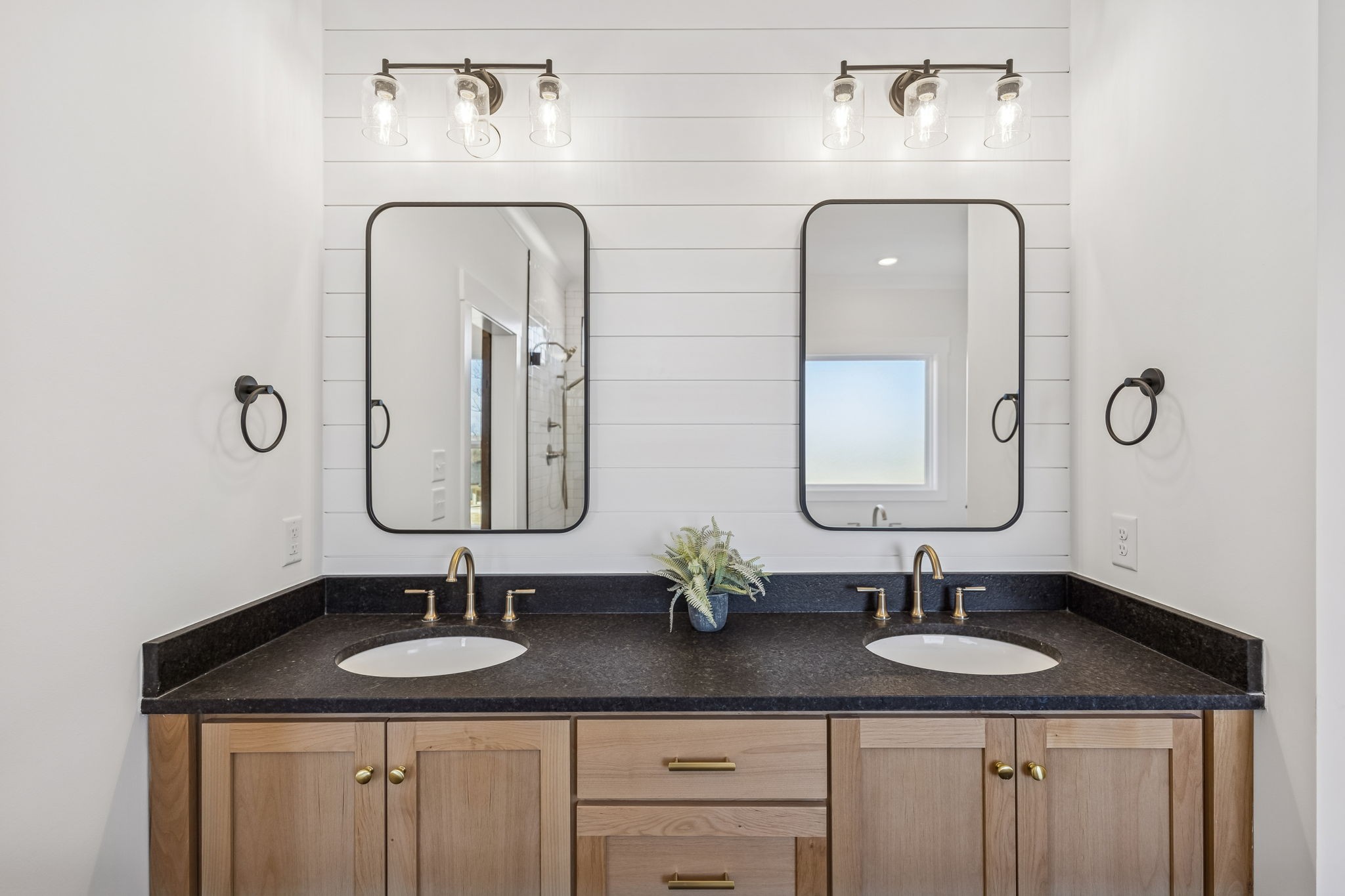13841 Cainsville Road Lebanon, TN 37090 - Photo 32 of 81 a bathroom with double vanity sinks and a mirror