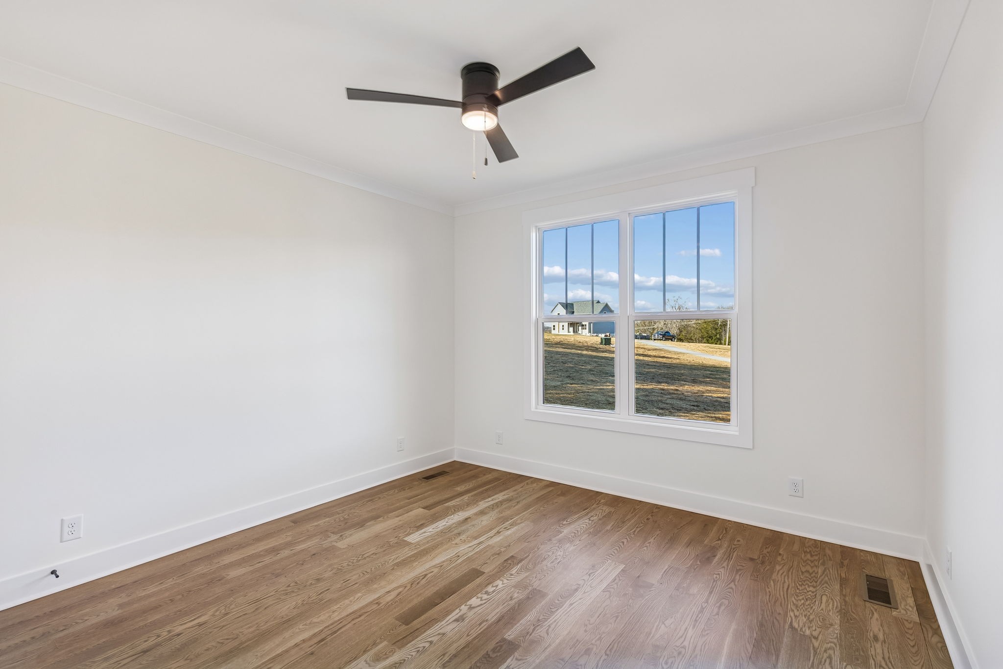 13841 Cainsville Road Lebanon, TN 37090 - Photo 38 of 81 a view of a livingroom with wooden floor and a ceiling fan