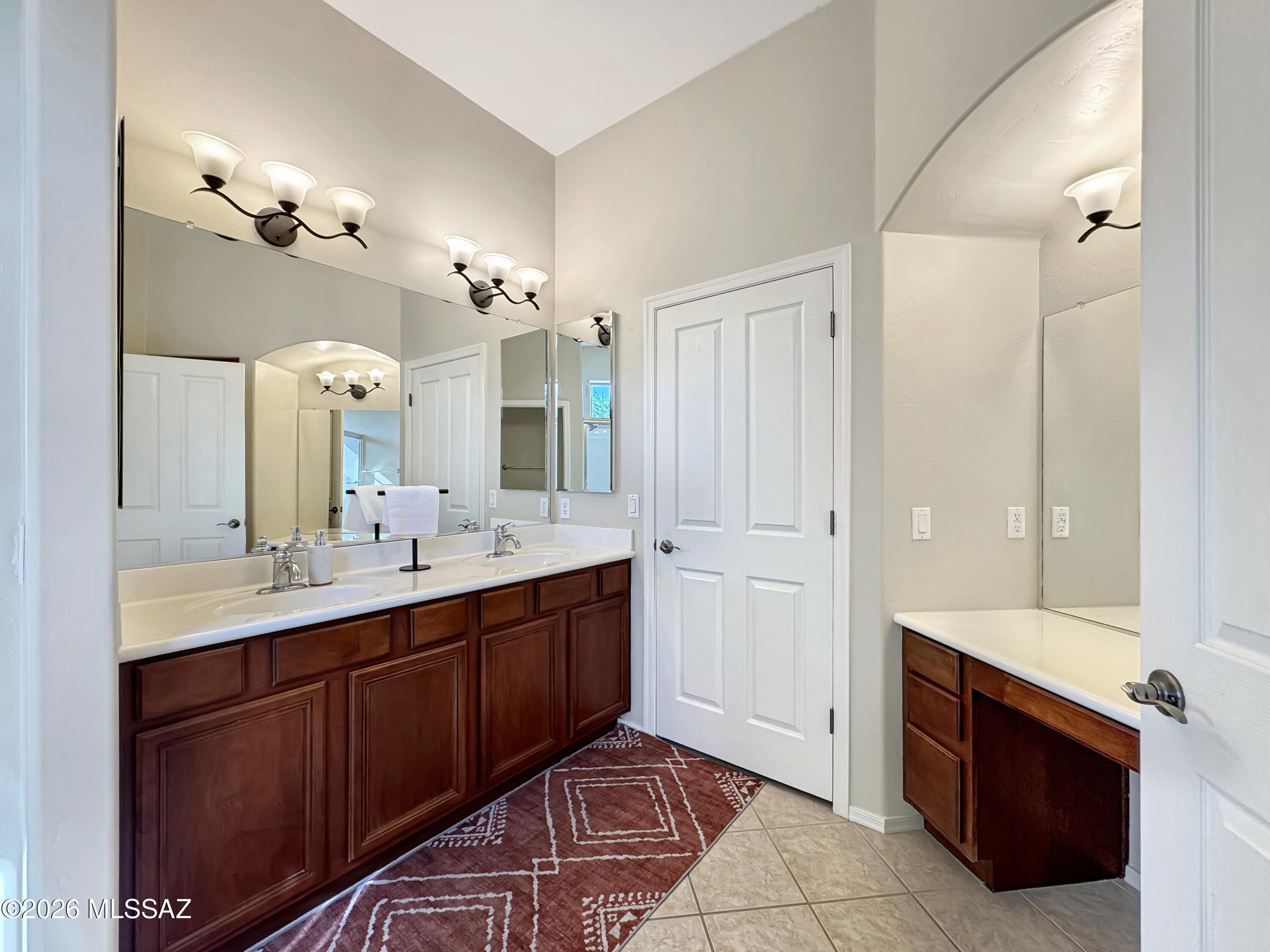 10835 South Heart Break Ridge Place Vail, AZ 85641 - Photo 24 of 49 a spacious bathroom with a double vanity sink a large mirror and a shower