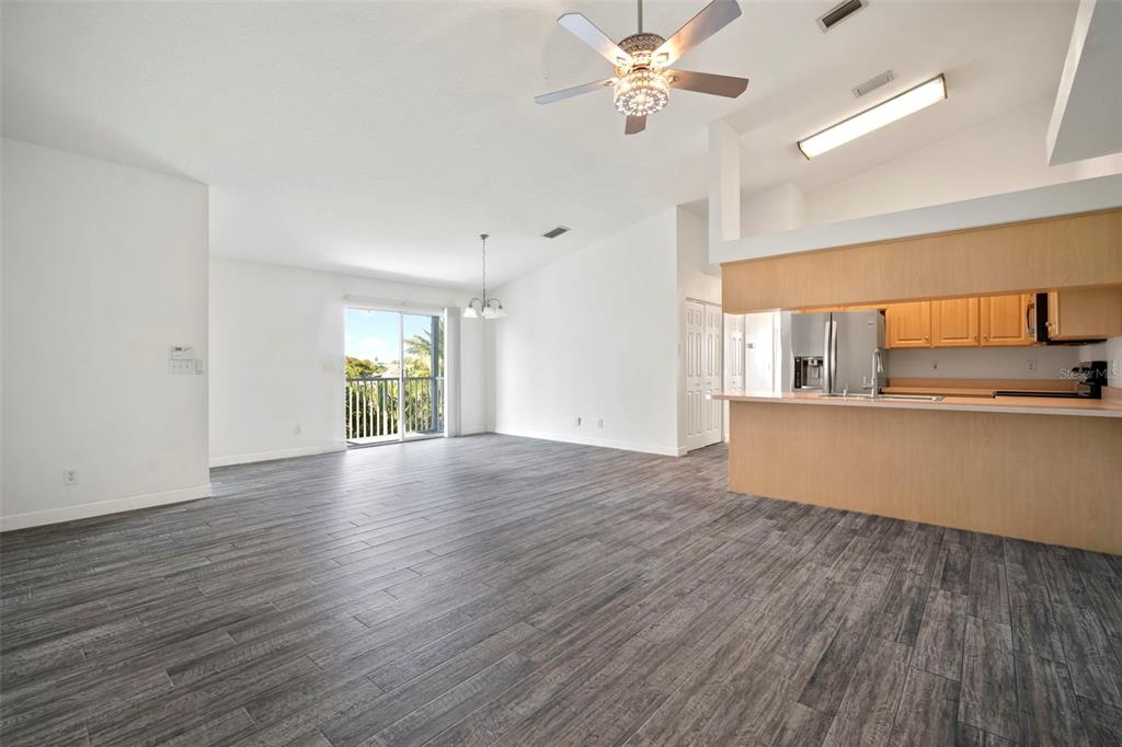 1013 Apollo Beach Boulevard, Unit 203 Apollo Beach, FL 33572 - Photo 15 of 26 a view of a kitchen with wooden floor and a kitchen space