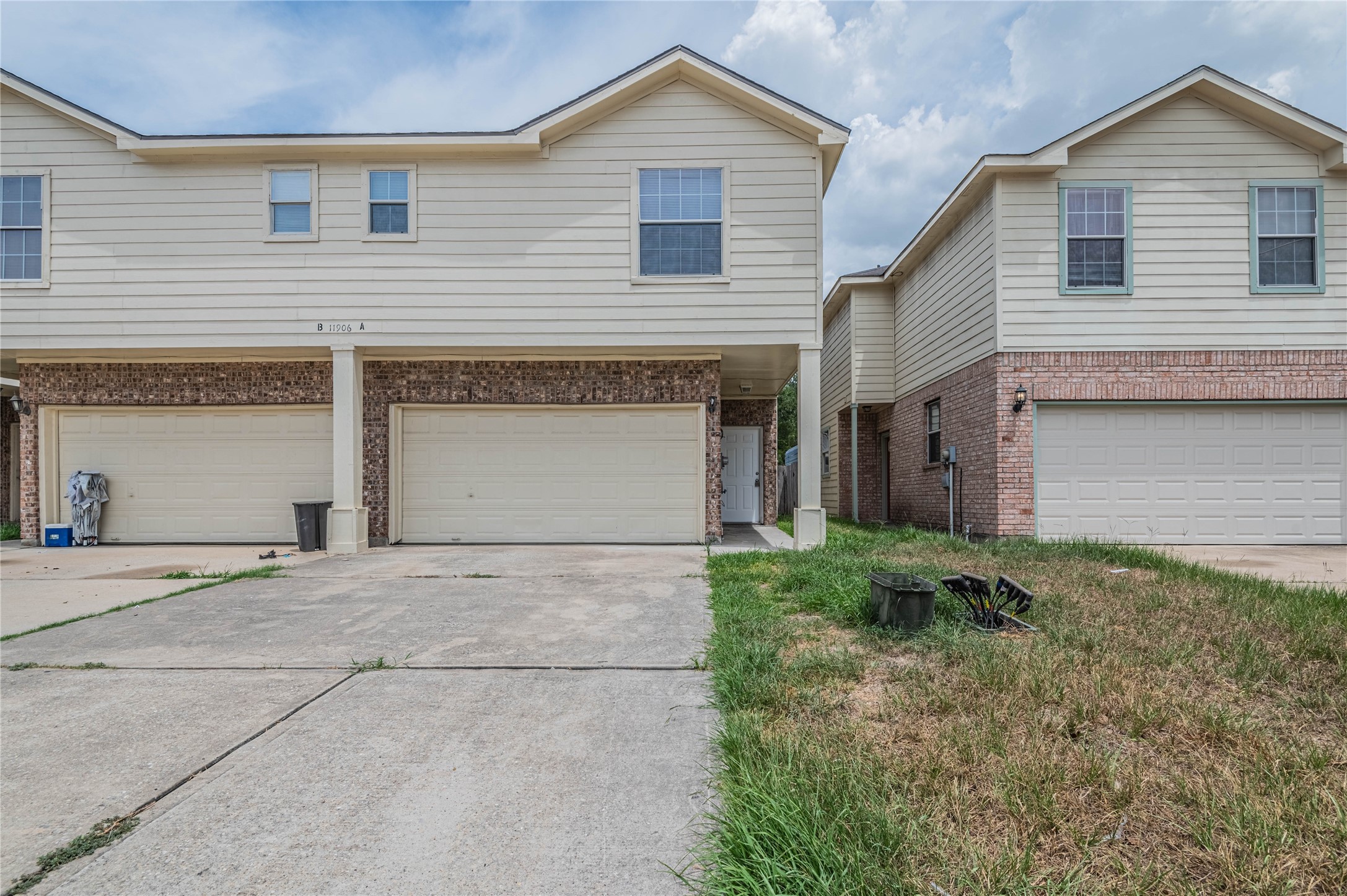 11906 Chetman Drive, Unit A Houston, TX 77065 - Photo 1 of 15 a front view of a house with a yard and garage