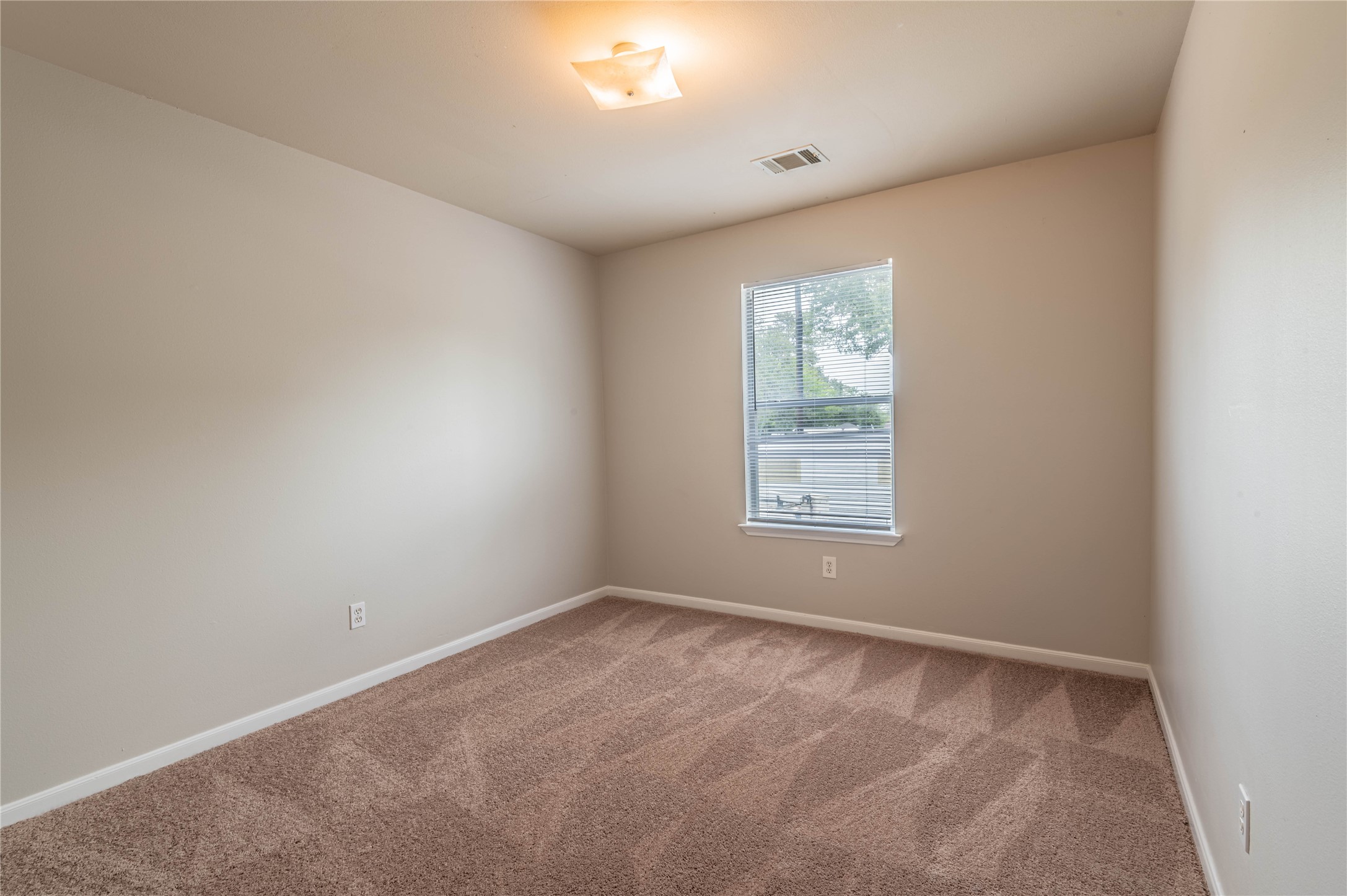 11906 Chetman Drive, Unit A Houston, TX 77065 - Photo 12 of 15 an empty room with a window
