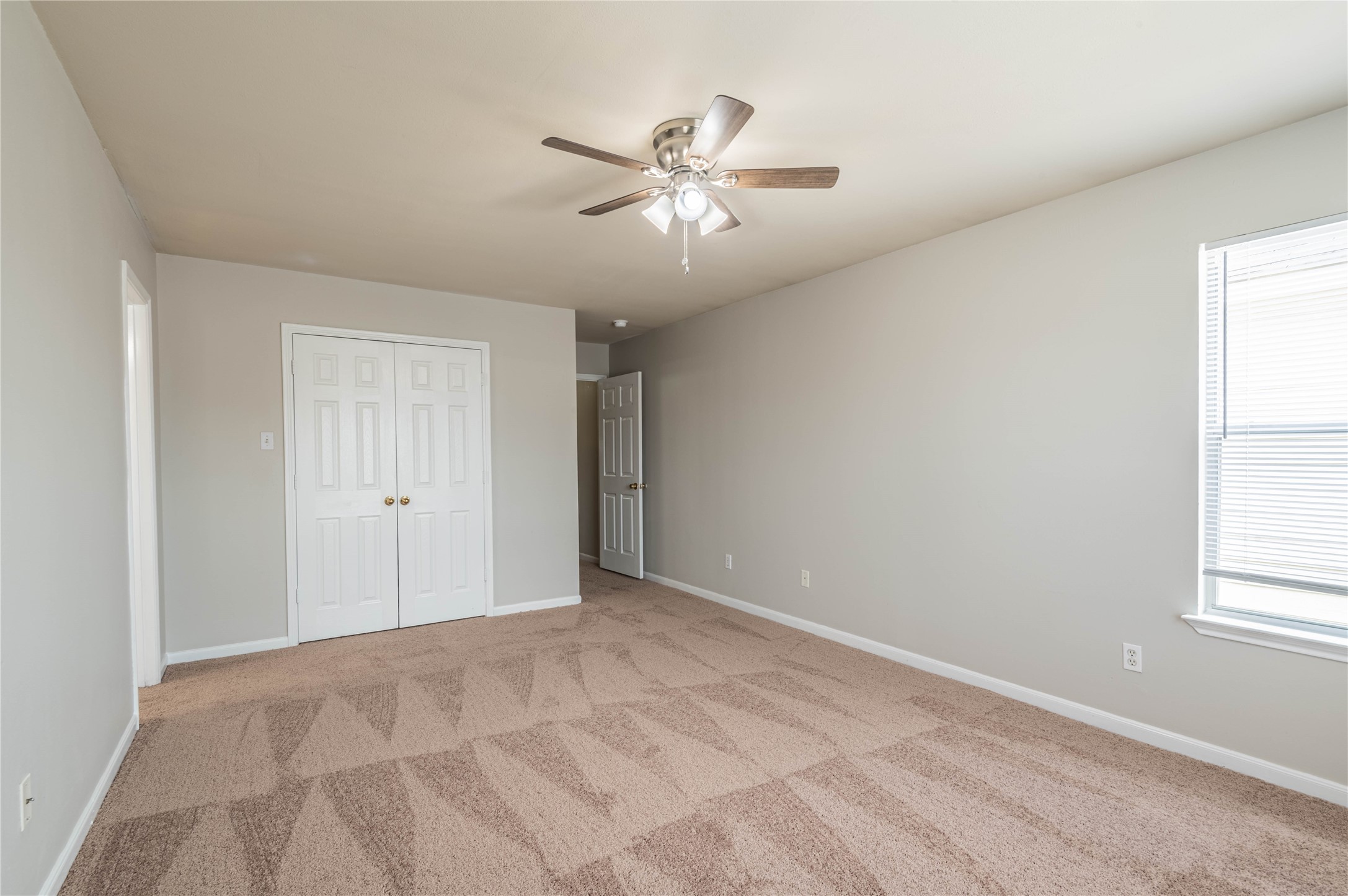 11906 Chetman Drive, Unit A Houston, TX 77065 - Photo 8 of 15 a view of an empty room with a window