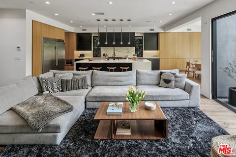 a living room with furniture and a table