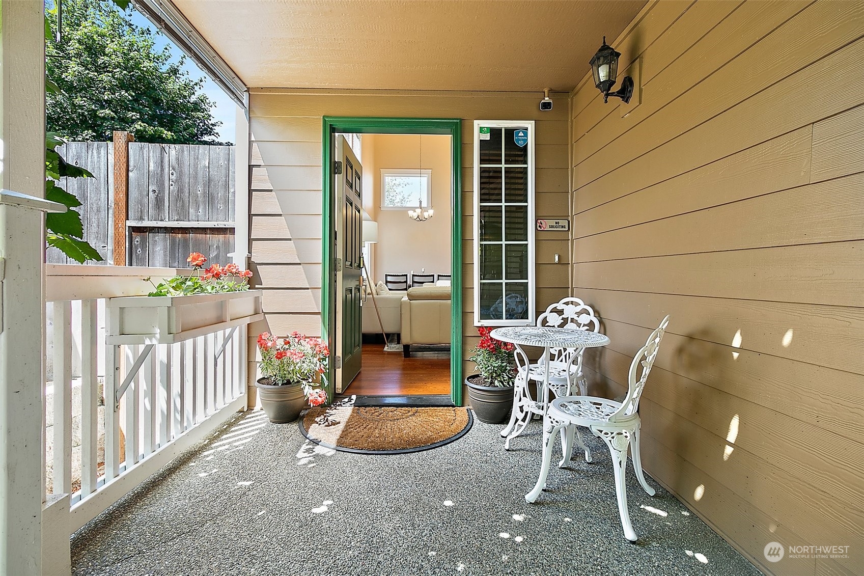 9604 South 236th Place Kent, WA 98031 - Photo 2 of 39 a view of a patio with table and chairs and potted plants