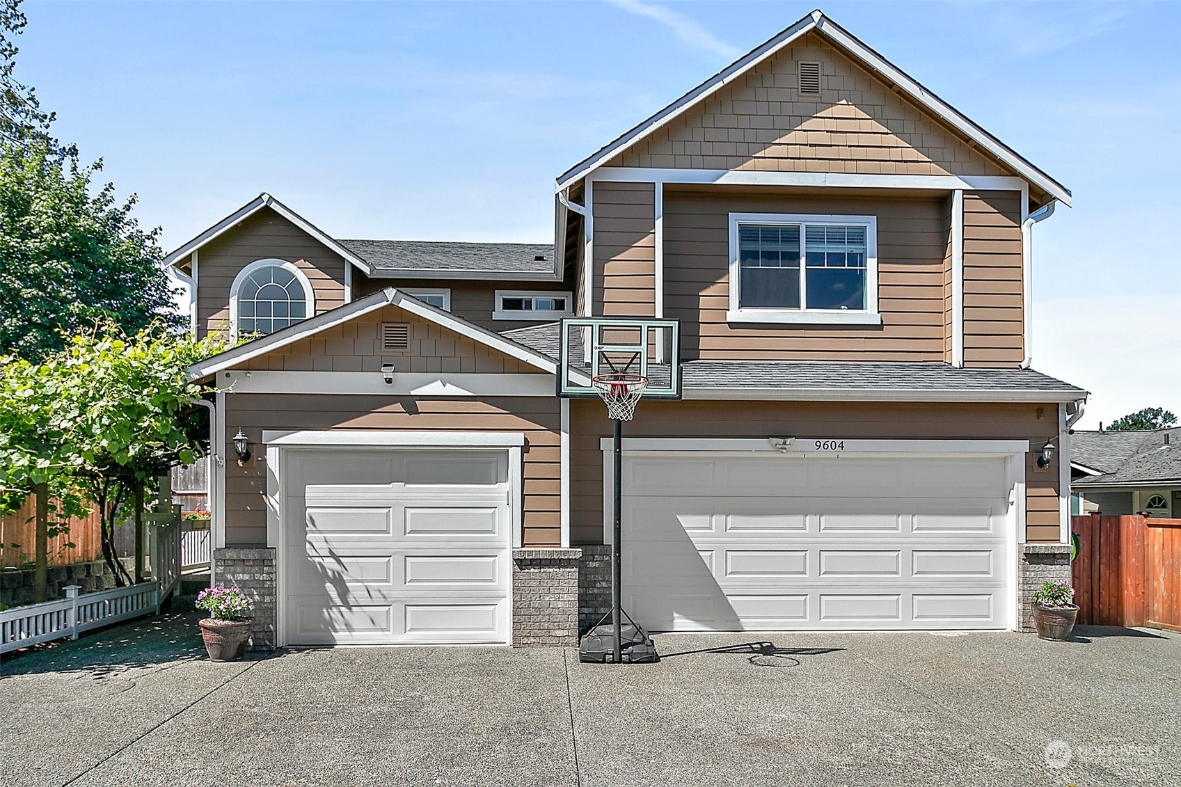 9604 South 236th Place Kent, WA 98031 - Photo 36 of 39 a front view of a house with a garage