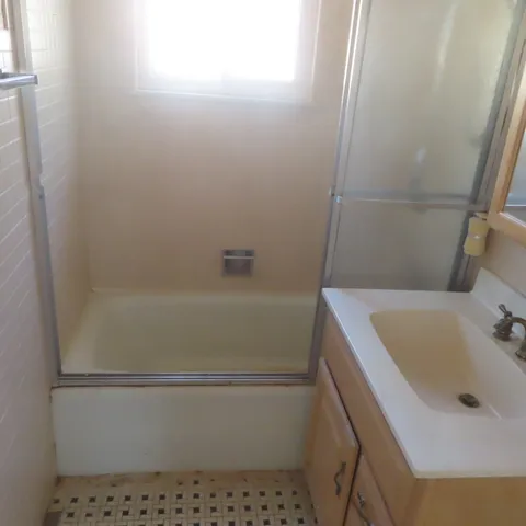 a bathroom with a sink and bathtub