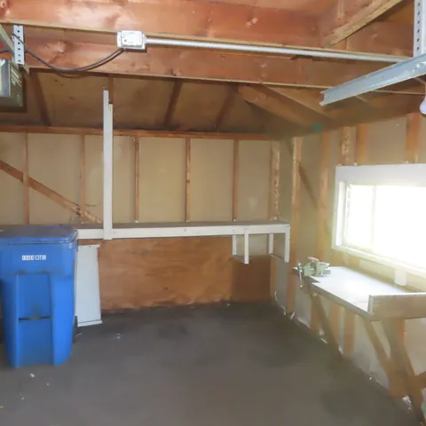 a view of a room with wooden walls