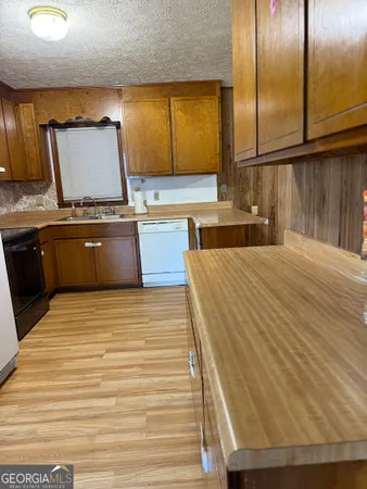 a spacious bathroom with a granite countertop tub and a sink