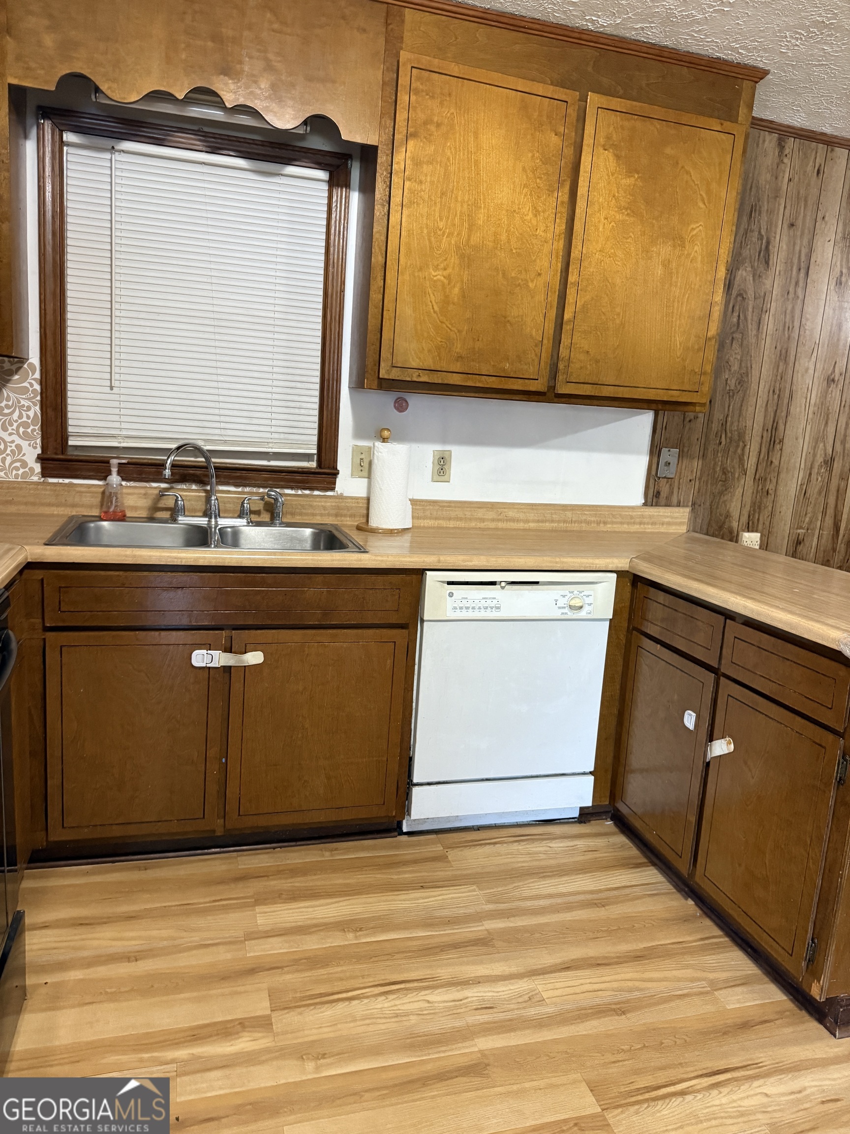 140 Rene Lane Cochran, GA 31014 - Photo 16 of 29 a view of a kitchen with wooden floor and a sink