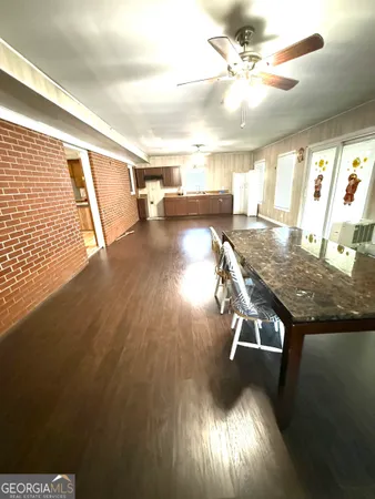 a view of a livingroom with furniture nad wooden floor