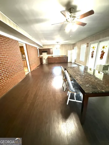a view of a livingroom with furniture nad wooden floor