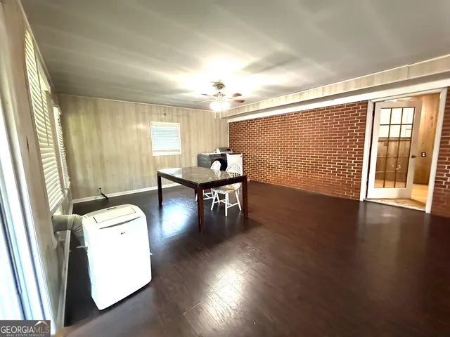 a view of a livingroom with furniture and wooden floor