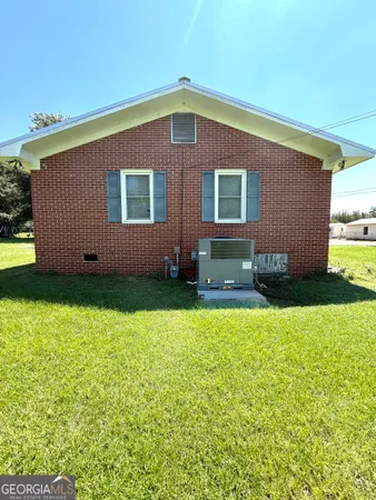 a backyard of a house with lots of green space