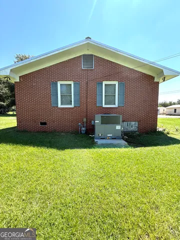 a backyard of a house with lots of green space
