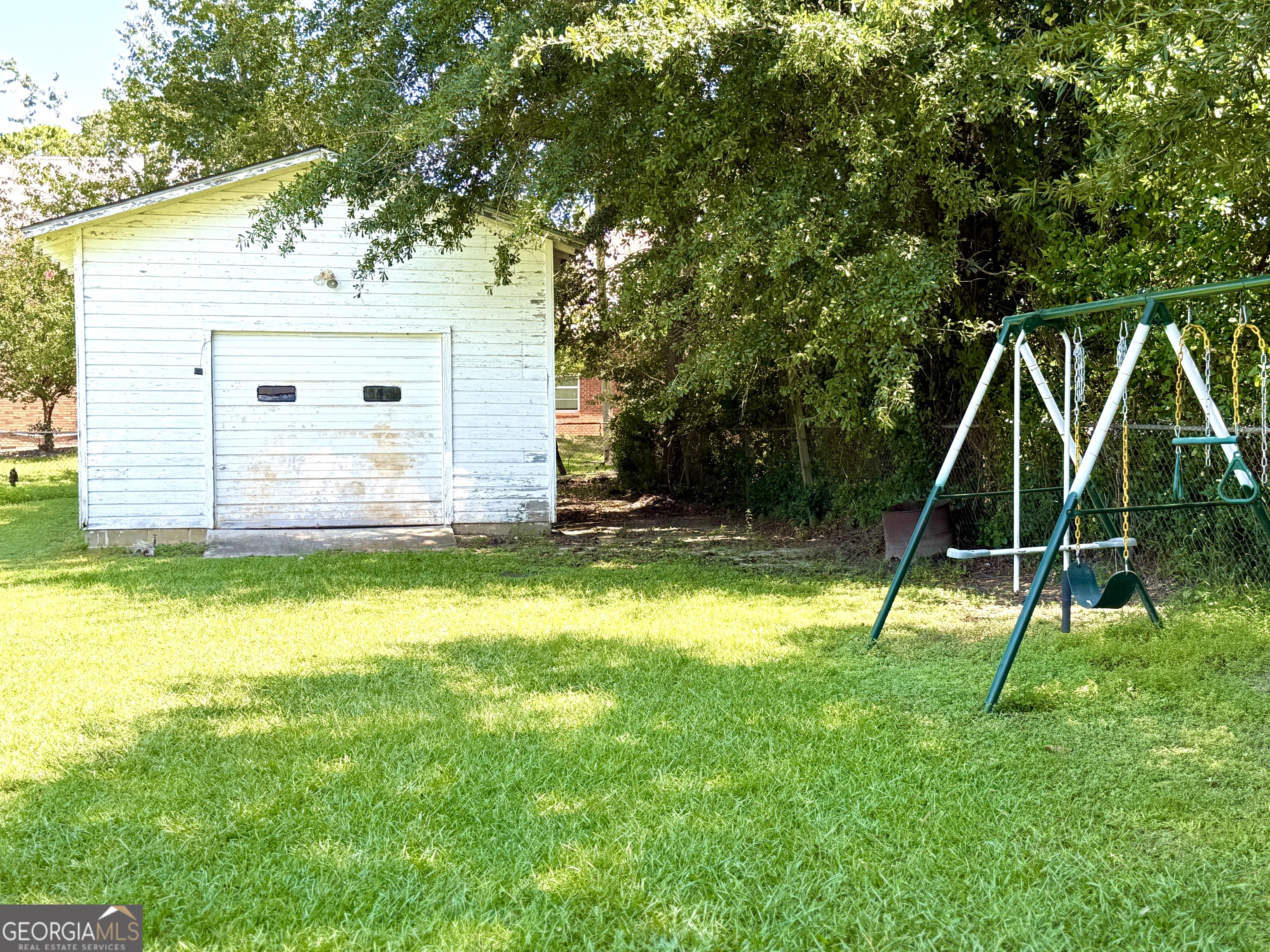 140 Rene Lane Cochran, GA 31014 - Photo 8 of 29 a view of a house with a backyard