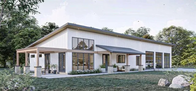 a front view of a house with a garden and porch