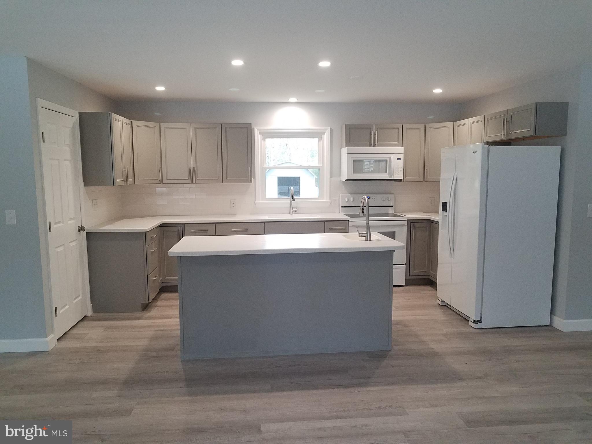 2123 Bypass Road Pocomoke City, MD 21851 - Photo 14 of 30 New kitchen with island and eating bar.