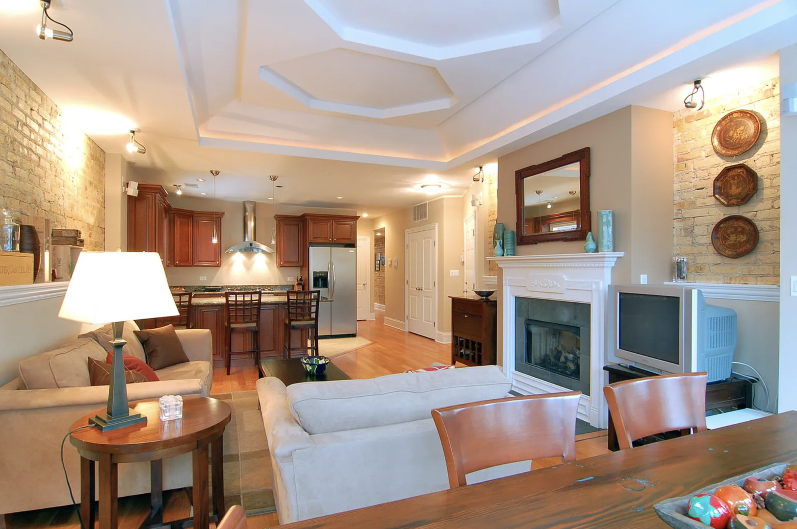 Undisclosed Address Chicago, IL 60613 - Photo 4 of 8 a living room with furniture and a fireplace