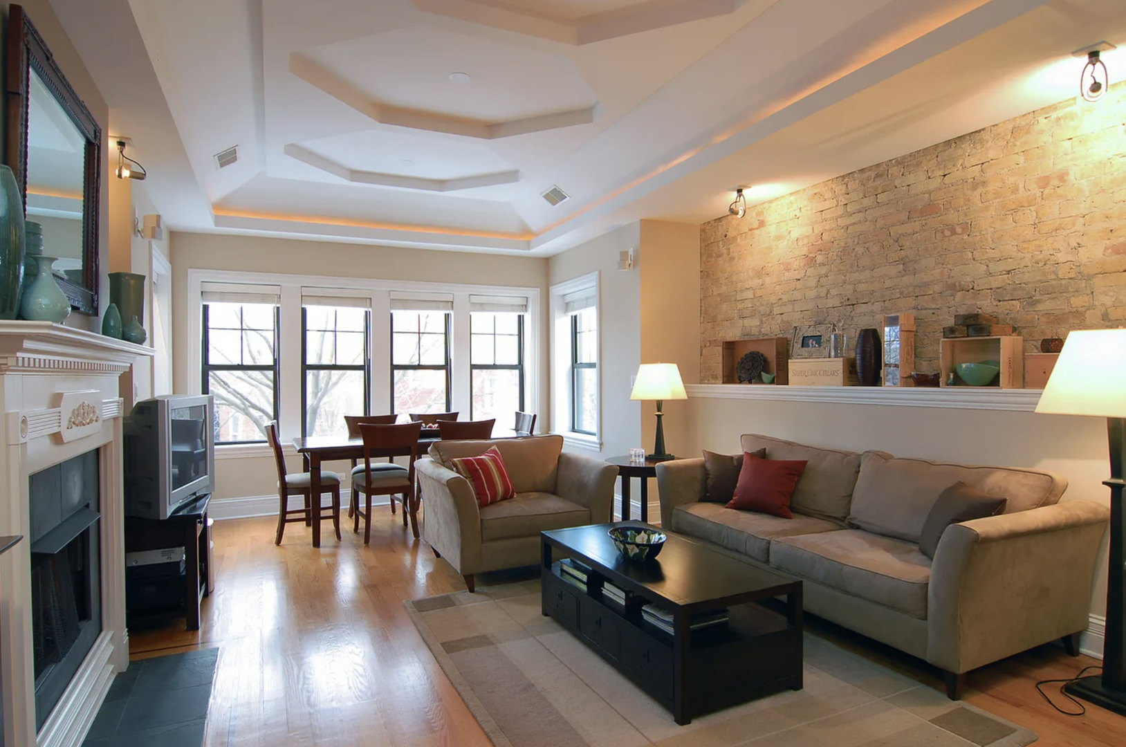 Undisclosed Address Chicago, IL 60613 - Photo 5 of 8 a living room with furniture and a fireplace