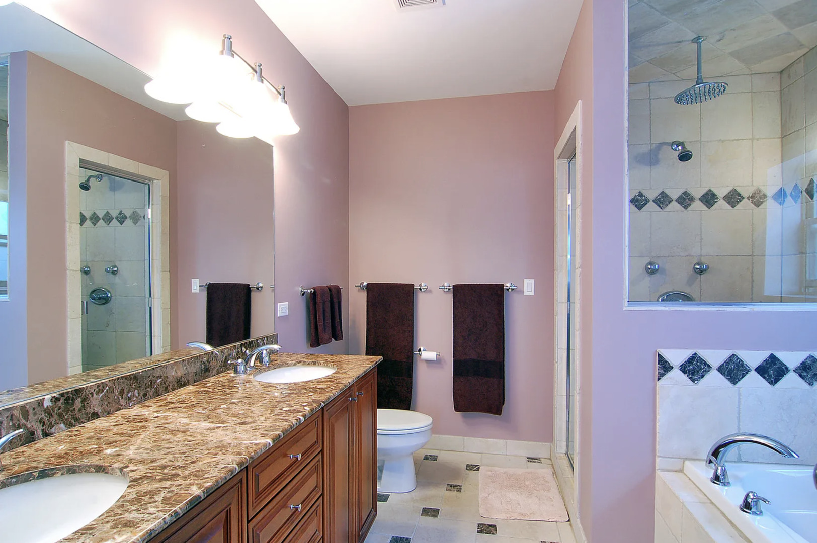 Undisclosed Address Chicago, IL 60613 - Photo 8 of 8 a bathroom with a granite countertop double vanity sink and a mirror