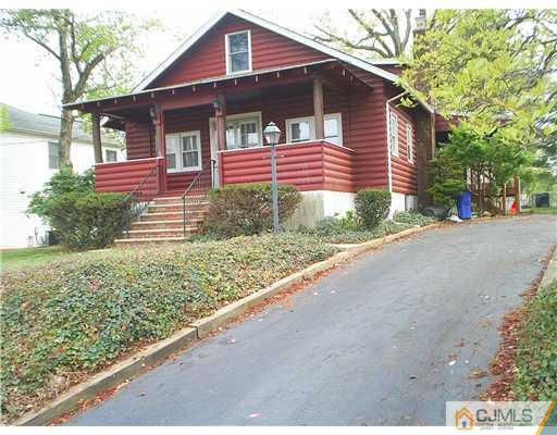 935 New Dover Road Edison, NJ 08820 - Photo 1 of 9 a front view of a house with a yard