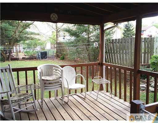 935 New Dover Road Edison, NJ 08820 - Photo 9 of 9 a view of a balcony with wooden floor