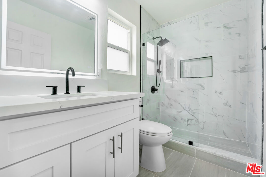 1255 26th Street, Unit 1 Santa Monica, CA 90404 - Photo 1 of 10 a bathroom with a sink toilet and shower