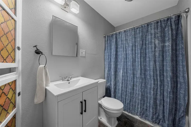 a bathroom with a sink and a toilet