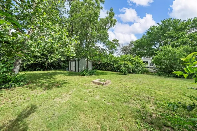 a backyard of a house with lots of green space