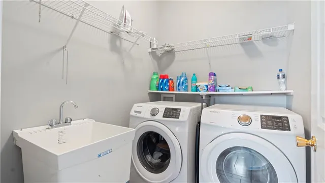 a utility room with dryer and washer