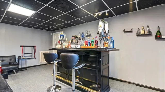 a dining room with furniture and a chandelier