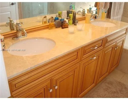 a bathroom with a sink a mirror and a bathtub