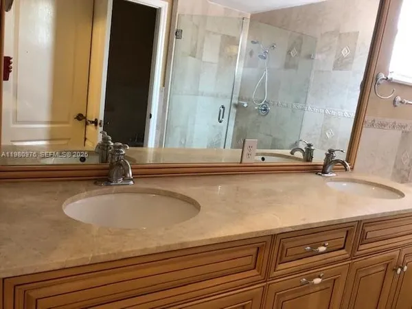 a bath room with a bath tub and a shower