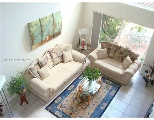 a kitchen with stainless steel appliances kitchen island granite countertop a refrigerator and a stove top oven