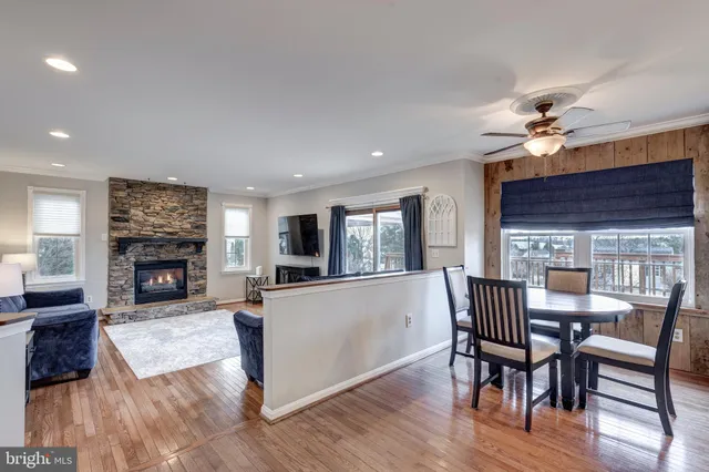 a view of a livingroom with furniture window and wooden floor
