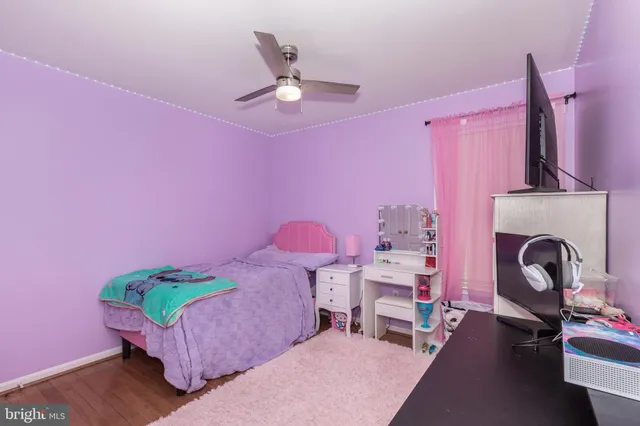 a bedroom with furniture and a fireplace