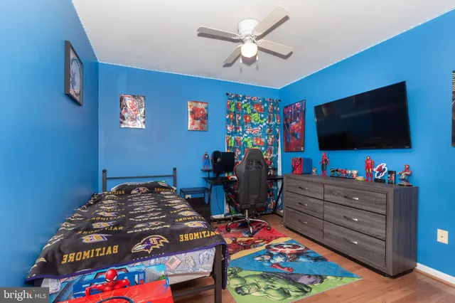 a bedroom with a bed and flat screen tv