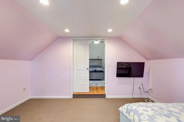 a living room with a flat screen tv and painted walls