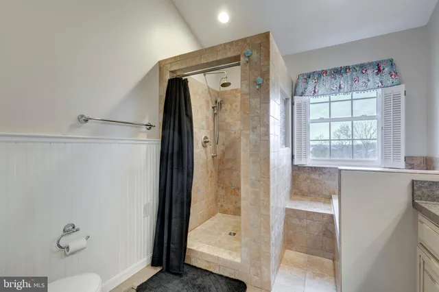 a bathroom with a shower and a tub