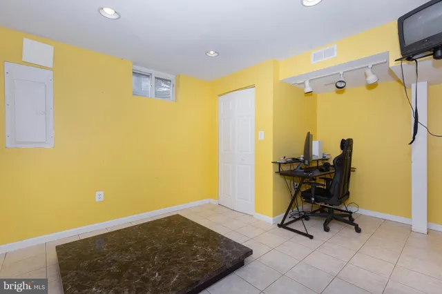 a view of a hallway with wooden floor and entryway