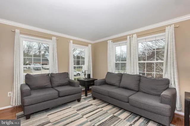 a living room with furniture and windows