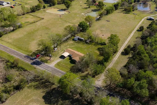 a view of a lake with a yard