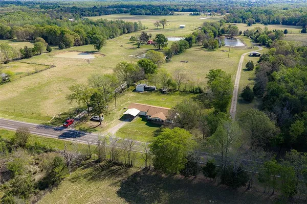 a view of a lake with a yard