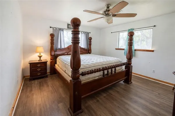 a bed room with a bed and a chandelier