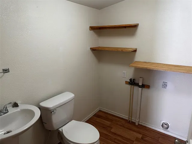 a bathroom with a toilet and a sink