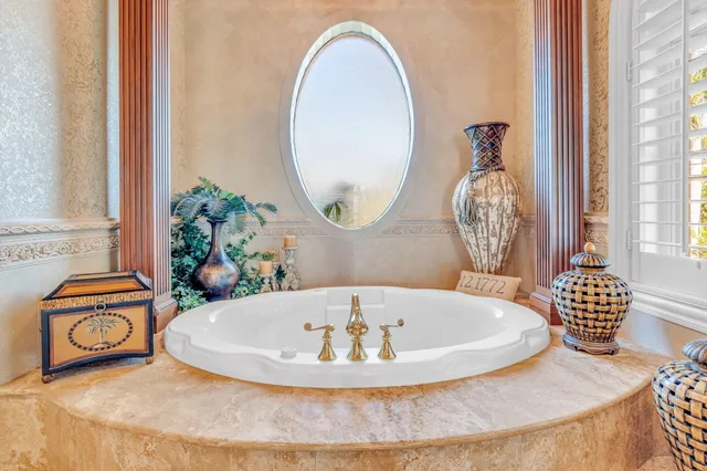 a view of a chair and tables in the balcony