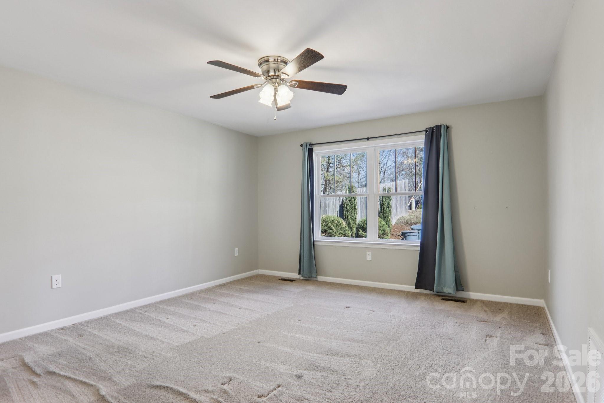 751 Hutch Mountain Road Fletcher, NC 28732 - Photo 20 of 48 a view of room with window and ceiling fan